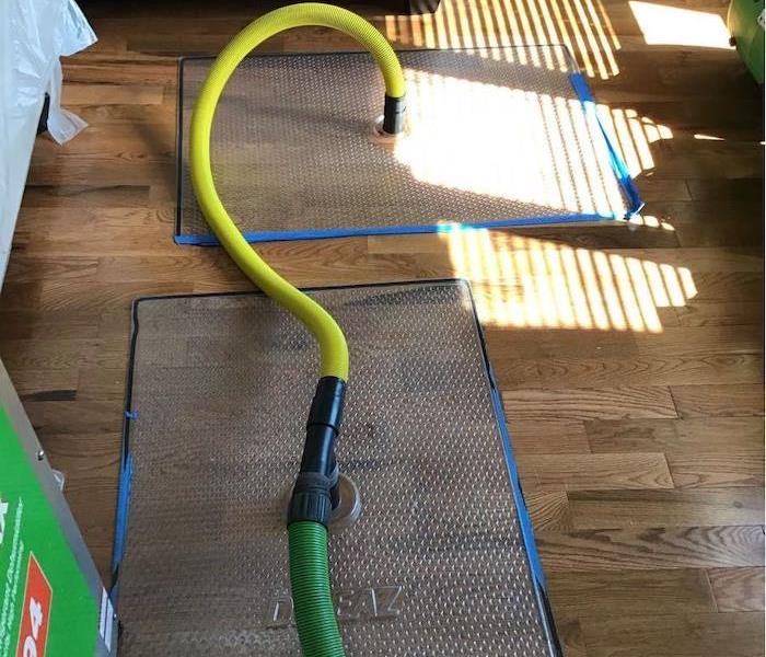 Hardwood flooring with SERVPRO drying mats